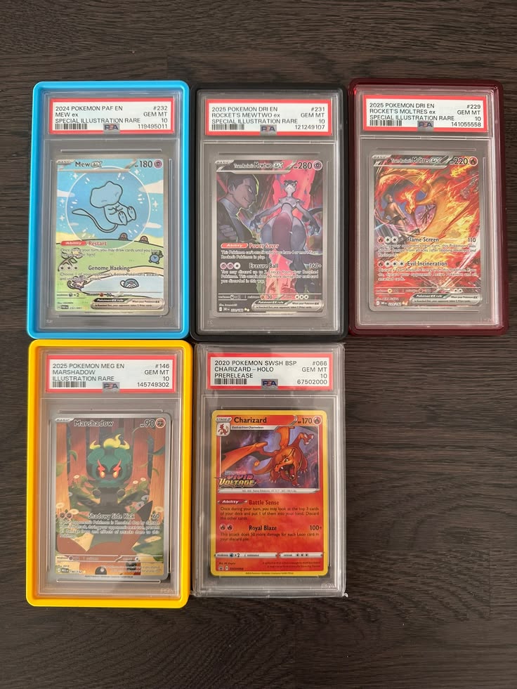 Five Pokémon cards displayed in graded protective slabs