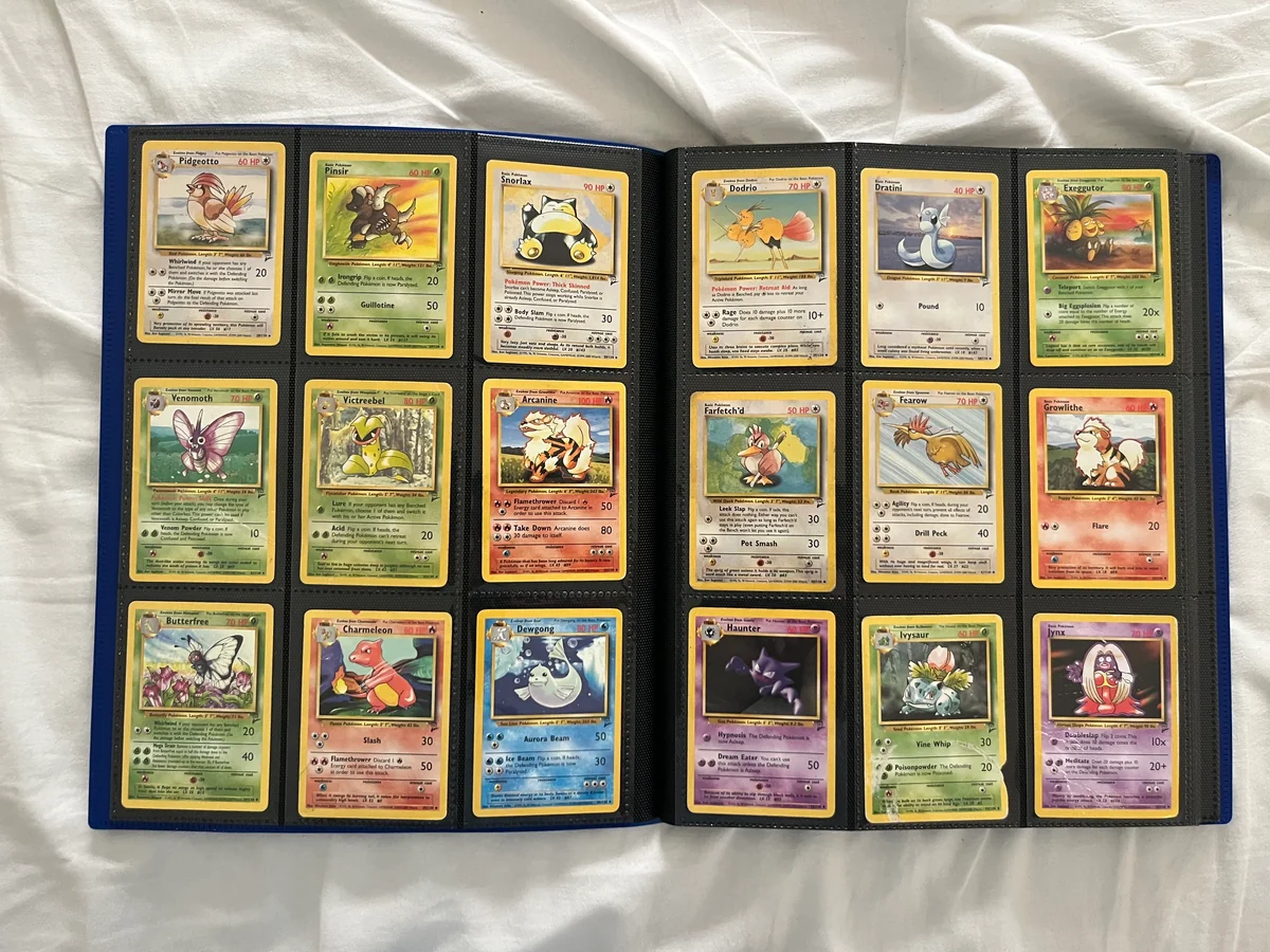 A vintage Pokémon card collection organized across two nine-pocket binder pages